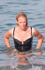 PHOEBE TOMLINSON in Swimsuit at Club 55 in Saint Tropez 08/26/2024
