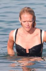 PHOEBE TOMLINSON in Swimsuit at Club 55 in Saint Tropez 08/26/2024