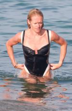 PHOEBE TOMLINSON in Swimsuit at Club 55 in Saint Tropez 08/26/2024