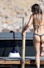 RITA ORA in  Striped Bikini at a Beach in Ibiza 08/22/2024