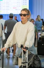 STELLA MAXWELL Arrives at LAX in Los Angeles 08/25/2024