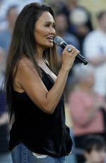 TIA CARRERE Sings National Anthem at Los Angeles Dodgers vs Baltimore Orioles Game at Dodger Stadium in Los Angeles 08/30/2024