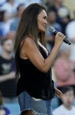 TIA CARRERE Sings National Anthem at Los Angeles Dodgers vs Baltimore Orioles Game at Dodger Stadium in Los Angeles 08/30/2024