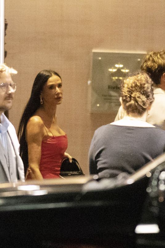 DEMI MOORE Arrives at Four Seasons Hotel with a Mystery Man in Toronto 09/07/2024