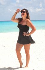 EMILY SIMPSON Poses on the Beach in Cancun 09/01/2024