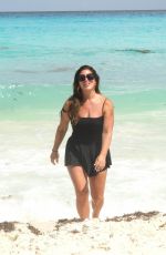 EMILY SIMPSON Poses on the Beach in Cancun 09/01/2024