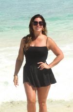 EMILY SIMPSON Poses on the Beach in Cancun 09/01/2024