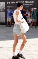 EMMA CORRIN in Denim Shorts Shopping at Bottega Veneta in Venice 08/31/2024