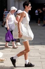 EMMA CORRIN in Denim Shorts Shopping at Bottega Veneta in Venice 08/31/2024
