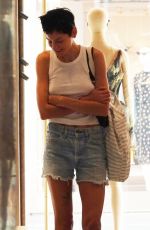 EMMA CORRIN in Denim Shorts Shopping at Bottega Veneta in Venice 08/31/2024