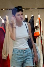 EMMA CORRIN in Denim Shorts Shopping at Bottega Veneta in Venice 08/31/2024