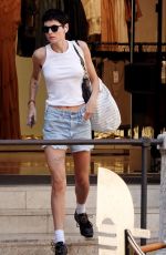 EMMA CORRIN in Denim Shorts Shopping at Bottega Veneta in Venice 08/31/2024
