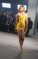 GIGI HADID in DHL Packing Tape Walks Vetements Runway Show in Paris 09/28/2024