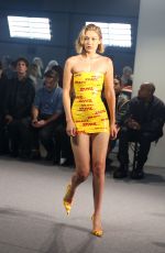 GIGI HADID in DHL Packing Tape Walks Vetements Runway Show in Paris 09/28/2024