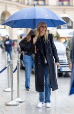 GWYNETH PALTROW Braves Rrain Out at PFW in Paris 09/25/2024