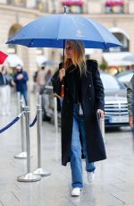 GWYNETH PALTROW Braves Rrain Out at PFW in Paris 09/25/2024