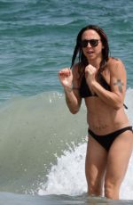 MELANIE CHISHOLM in Bikini at a Beach in Ibiza 09/01/2024