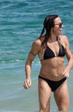 MELANIE CHISHOLM in Bikini at a Beach in Ibiza 09/01/2024