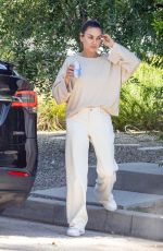 MILA KUNIS Leaves a Friend