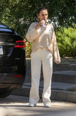 MILA KUNIS Leaves a Friend