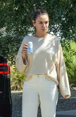 MILA KUNIS Leaves a Friend