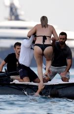 Pregnant MARGOT ROBBIE in a Black Bikini on Vacation in Italy 08/30/2024