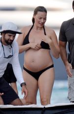 Pregnant MARGOT ROBBIE in a Black Bikini on Vacation in Italy 08/30/2024