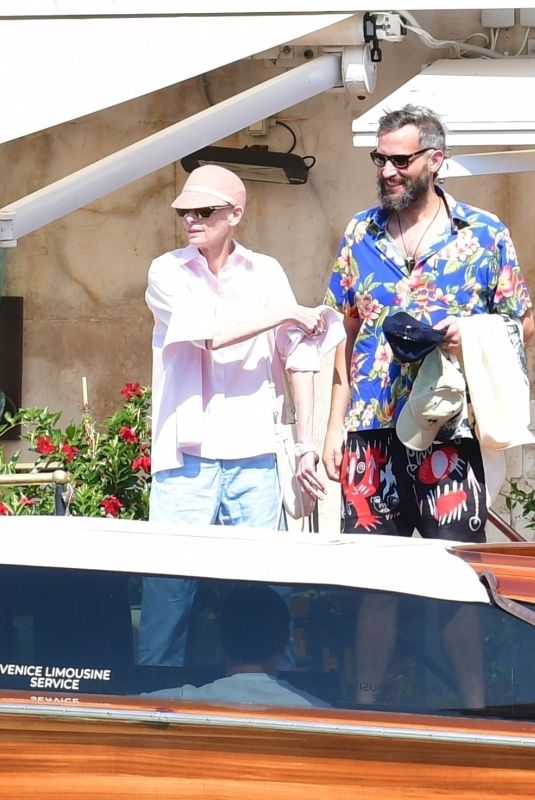 TILDA SWINTON and Sandro Kopp Catching a Taxi Boat in Venice 08/31/2024