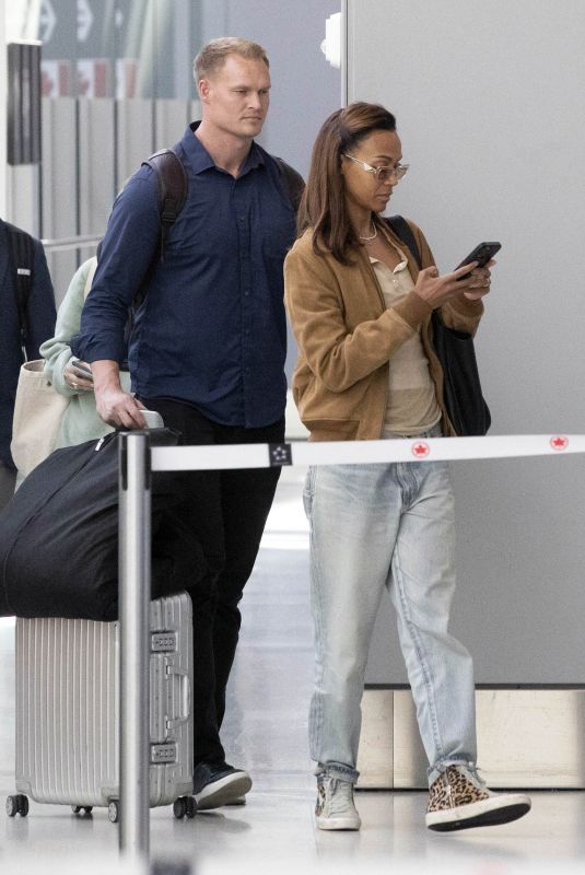 ZOE SALDANA Arrives at Airport in Toronto 09/10/2024