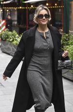 AMANDA HOLDEN and ASHLEY ROBERTS Ride a Tandem Bike at Leicester Square in London 10/03/2024