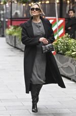 AMANDA HOLDEN and ASHLEY ROBERTS Ride a Tandem Bike at Leicester Square in London 10/03/2024