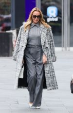 AMANDA HOLDEN and ASHLEY ROBERTS Ride a Tandem Bike at Leicester Square in London 10/03/2024