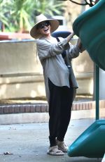 CHRISSY TEIGEN at a Park on Beverly Glen in Los Angeles 10/04/2024