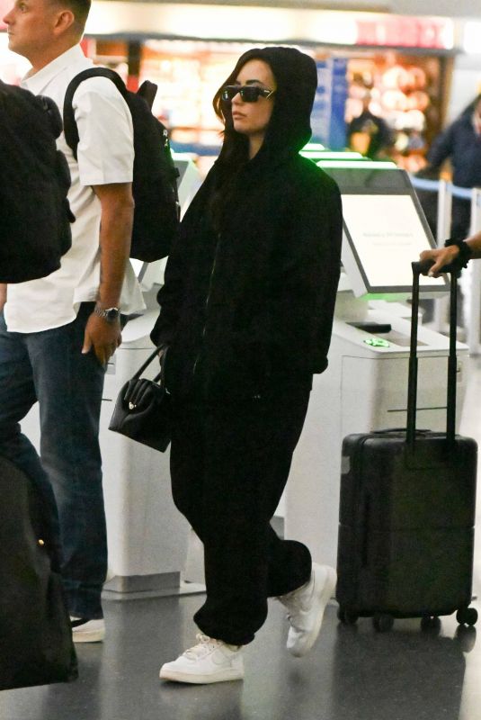 DEMI LOVATO Arrives at JFK Airport in New York 10/08/2024