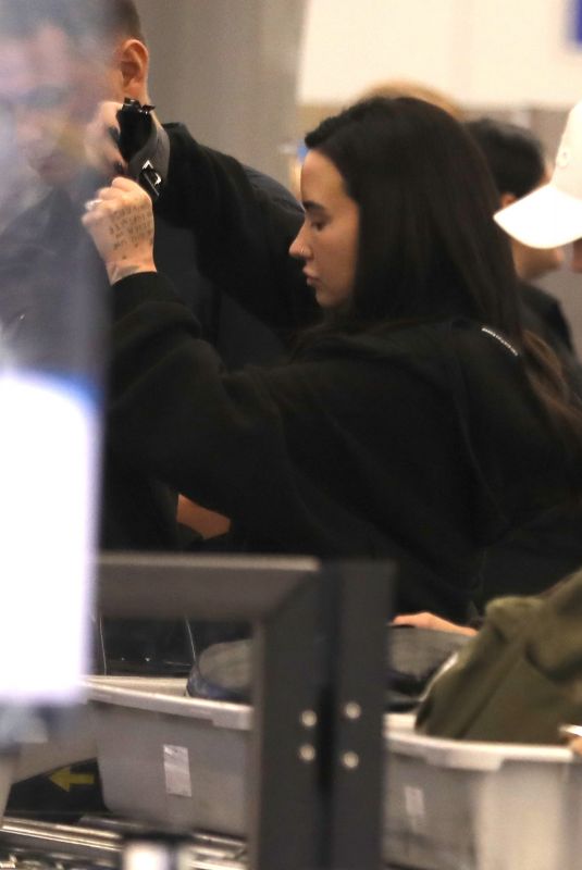 DEMI LOVATO Caught a Flight Out of Los Angeles 10/18/2024