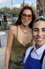 DUA LIPA Poses with Staff at Mexican Seafood Restaurant Este in Austin 10/05/2024