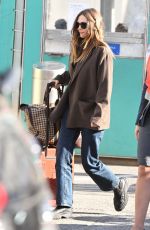 ELIZABETH OLSEN Arrives at JFK Airport in New York 10/16/2024