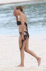 GILLIAN ANDERSON in Bikini at a Beach in Mexico, October 2024