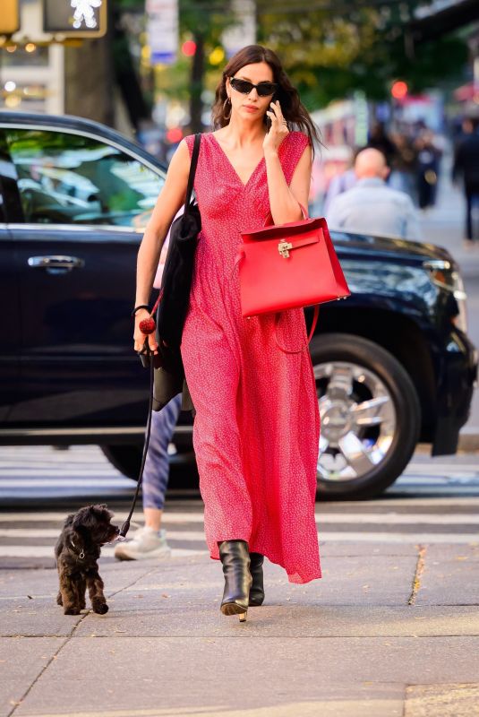 IRINA SHAYK in a Red Dress Out with Her Dog in New York 10/21/2024
