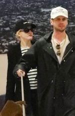 JULIA GARNER and Mark Foster Arrives at Burbank Airport in Los Angeles 10/05/2024