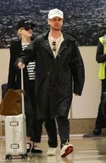 JULIA GARNER and Mark Foster Arrives at Burbank Airport in Los Angeles 10/05/2024
