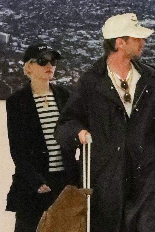 JULIA GARNER and Mark Foster Arrives at Burbank Airport in Los Angeles 10/05/2024
