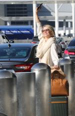 JULIANNE HOUGH Flagging Down Her Uber at LAX Airport in Los Angeles 10/24/2024