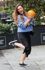 KELLY BROOK Leaves Heart Radio with a Pumpkin in London 10/31/2024