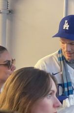 MILA KUNIS and Ashton Kutcher at Dodgers World Series Game in Los Angeles 10/25/2024