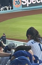 MILA KUNIS and Ashton Kutcher at Dodgers World Series Game in Los Angeles 10/25/2024