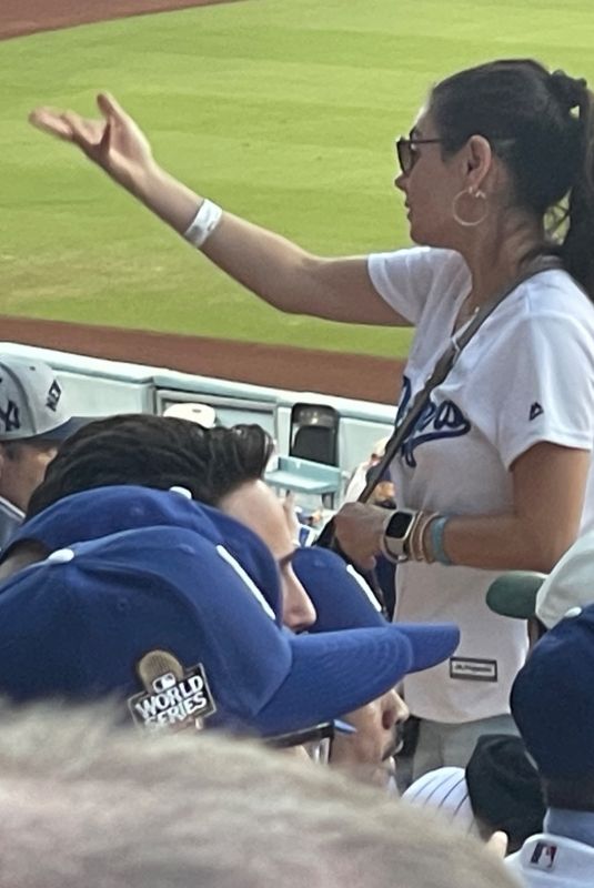 MILA KUNIS and Ashton Kutcher at Dodgers World Series Game in Los Angeles 10/25/2024