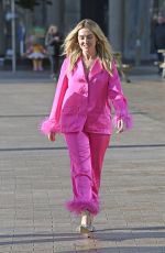 PERRIE EDWARDS in a Feather Trimmed Pink Pyjama Set Out in Manchester 10/08/2024