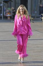 PERRIE EDWARDS in a Feather Trimmed Pink Pyjama Set Out in Manchester 10/08/2024