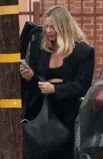 Pregnant MARGOT ROBBIE Arrives at an Office Building in Santa Monica 10/01/2024